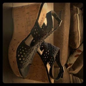 Heeled sandals with a black mesh fabric